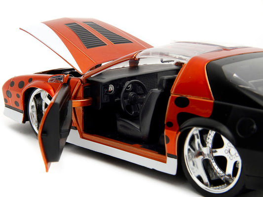 1985 Chevrolet Camaro Z/28 1:24 Diecast Model Car with Chester Cheetah Figure by Jada